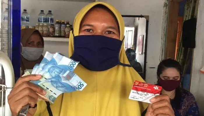 Ilustrasi bansos PKH dan BNPT cair.