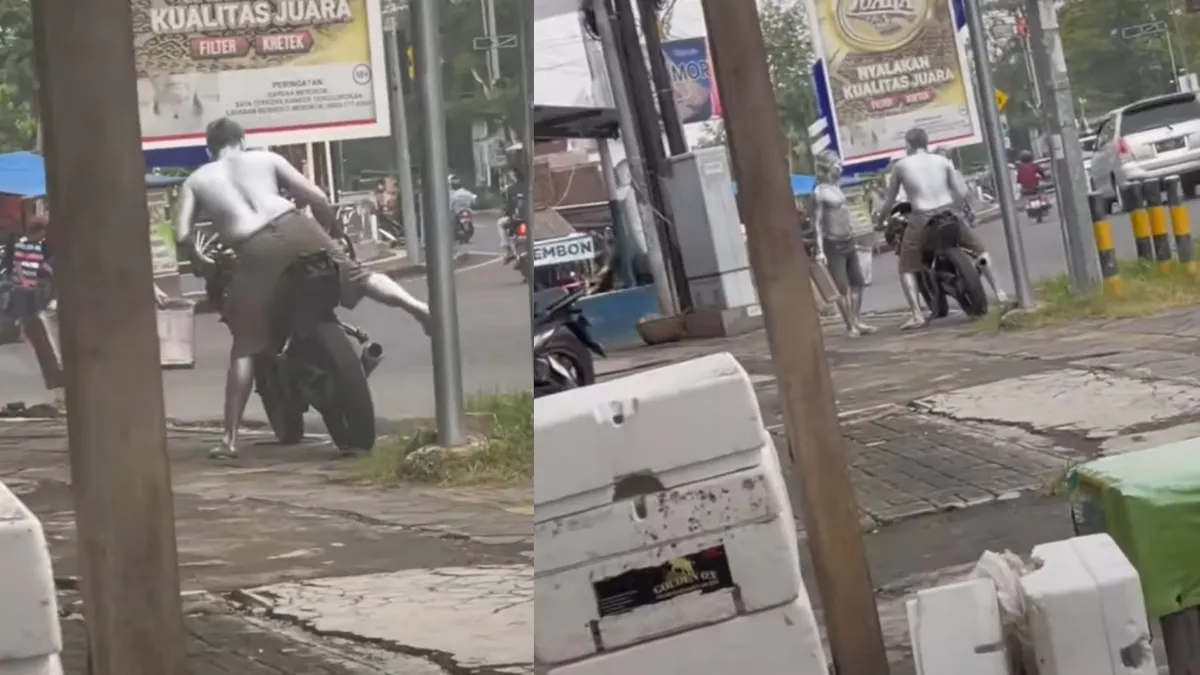 Viral video di media sosial menampilkan manusia silver sedang berada di sebuah perempatan lampu merah pakai motor sport.
