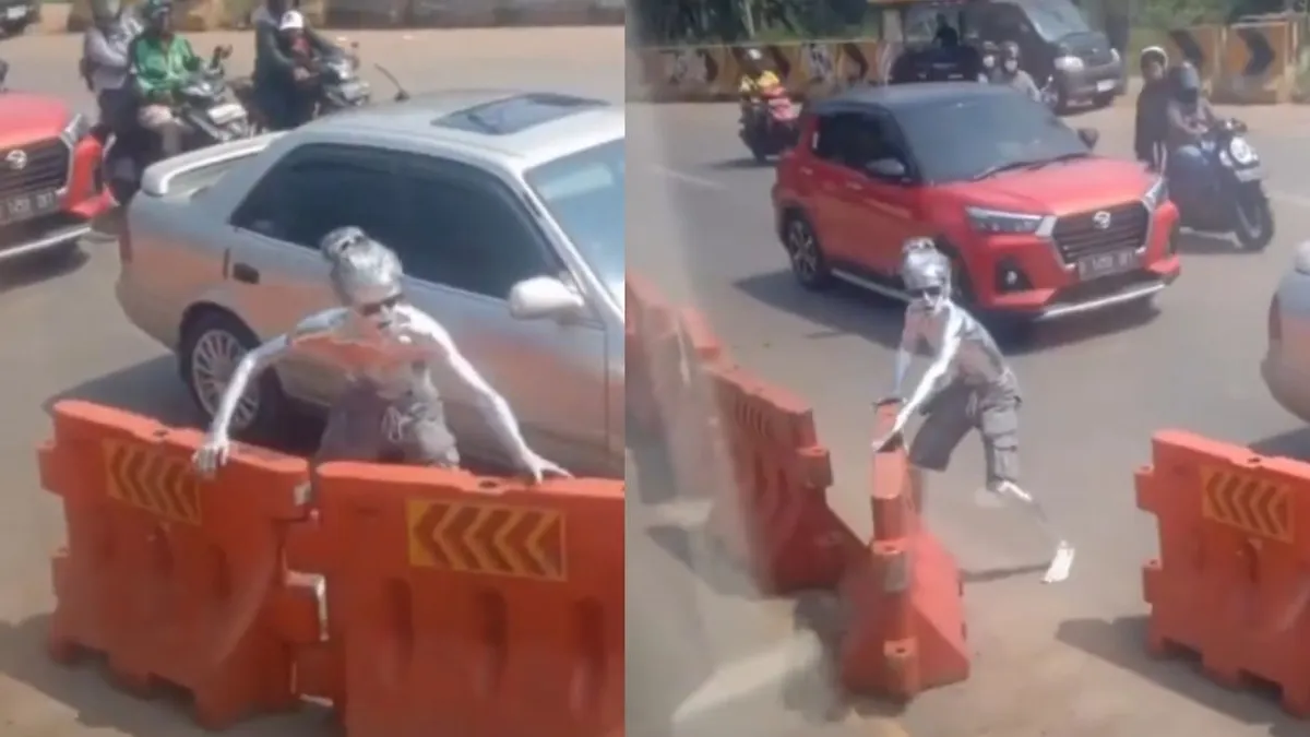 muncul sebuah video yang menampilkan aksi viral manusia silver membukakan jalan untuk mobil ambulans.