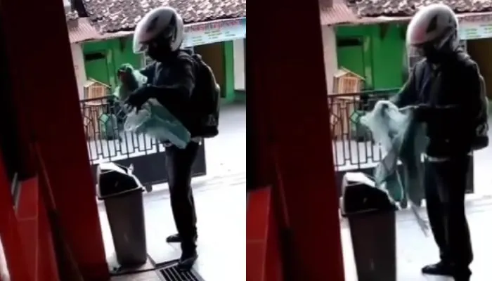 Pria Kesal Merobek Baju
