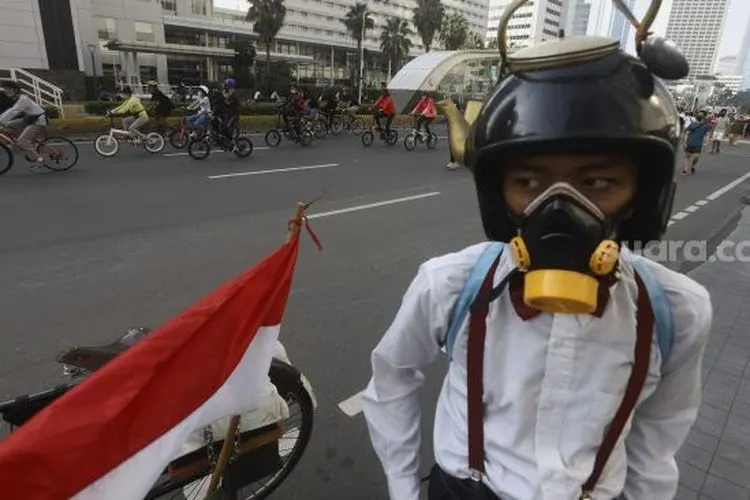 sebagai ilustrasi.  Sejumlah warga berolahraga di Jalan M.H Thamrin, Jakarta, Minggu (21/6/2020). [Suara.com/Angga Budhiyanto]