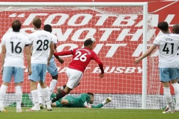 Striker Manchester United Mason Greenwood merayakan golnya ke gawang West Ham United dalam lanjutan Liga Inggris di Old Trafford. Clive Brunskill / POOL / AFP