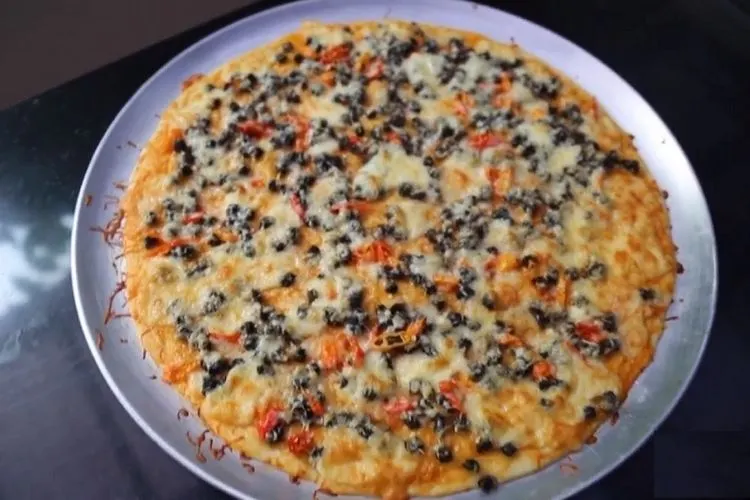 Pizza keong sawah ala Susi Pudjiastuti bisa menjadi referensi kuliner Ramadan. instagram: @susipudjiastuti115