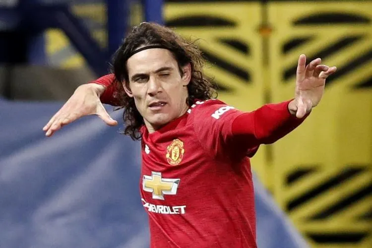Selebrasi gol penyerang Manchester United, Edinson Cavani. Foto: EPA-EFE/Clive Brunskill