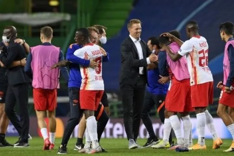 Selebrasi Julian Nagelsmann usai mengantar RB Leipzig lolos ke semifinal Liga Champions. (LLUIS GENE / POOL / AFP)