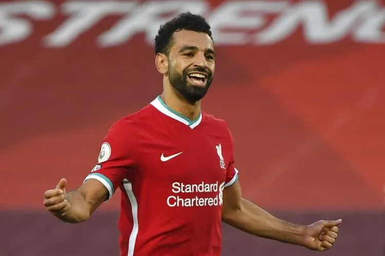 Striker Liverpool, Mohamed Salah, merayakan golnya usai menjebol gawang Leeds United di laga pekan pertama Liga Primer Inggris di Stadion Anfield, Liverpool, Sabtu (12/9/2020). (Foto: Shaun Botterill, Pool via AP)