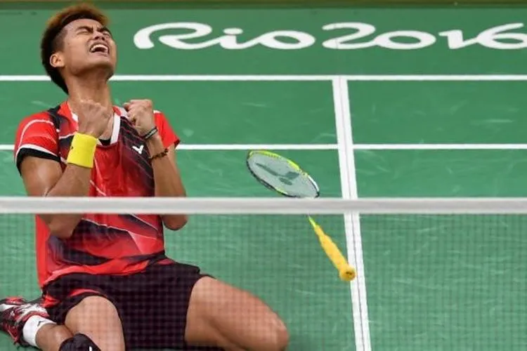 Tontowi Ahmad resmi pensiun dari bulu tangkis profeisonal. [AFP/Ben Stansall]