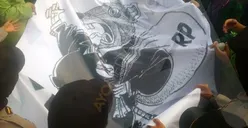 Tolak Revisi UU KPK, Mahasiswa Beri Spanduk Bergambar Tikus Berdasi kepada Polisi