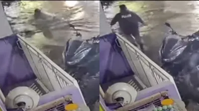 Viral, Aksi Heroik Warga Selamatkan Pengemudi Ojol yang Tercebur ke Saluran Air Akibat Banjir