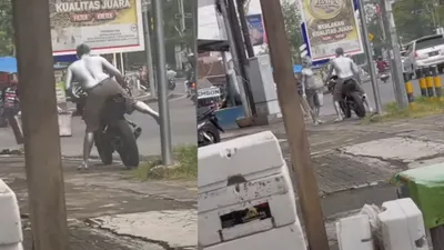 Viral video di media sosial menampilkan manusia silver sedang berada di sebuah perempatan lampu merah pakai motor sport.
