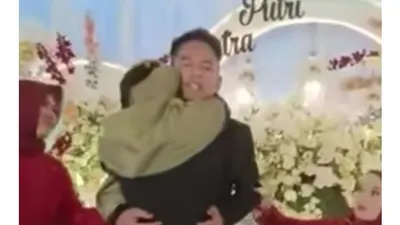 Viral sosok mempelai pria mendadak dirangkul seorang tamu wanita