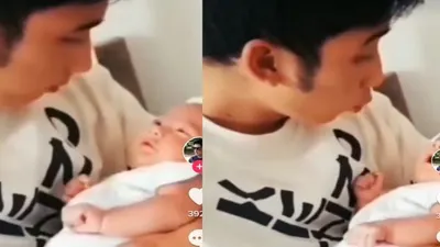 Alshad Ahmad Tampak Menggendong Seorang Bayi yang Menggemaskan