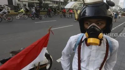 sebagai ilustrasi.  Sejumlah warga berolahraga di Jalan M.H Thamrin, Jakarta, Minggu (21/6/2020). [Suara.com/Angga Budhiyanto]