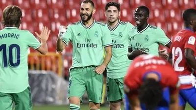 Striker Karim Benzema mencetak gol kemenangan Real Madrid atas Granada di laga lanjutan Liga Spanyol pekan ke-36, Selasa (14/7/2020) dini hari WIB. (Foto: AFP/Jorge Guerrero)