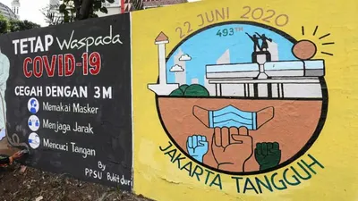 Mural bertema Covid-19 karya petugas Penanganan Prasarana Sarana Umum (PPSU) Kelurahan Bukit Duri di Jalan Abdulah Syafei, Tebet, Jakarta Selatan/beritajakarta.id/reza