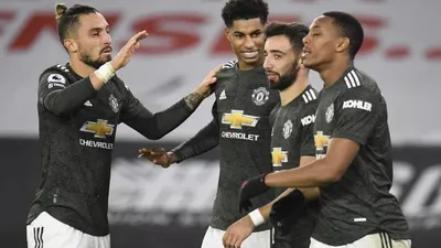Para pemain Manchester United merayakan gol Marcus Rashford (kedua kiri) dalam pertandingan melawan Sheffield United.  Foto: EPA-EFE/Peter Powell