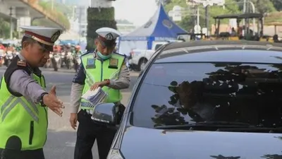 Hari pertama perluasan ganjil genap di Jakarta, Senin (9/9/2019). (Suara.com/Angga Budhiyanto)