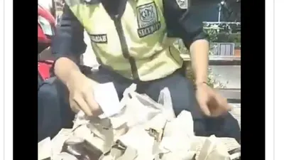 Video satpam tebak-tebakan isi nasi bungkus menggunakan termometer tembak (Twitter:  @MISSARAP)