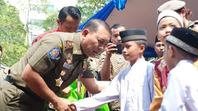 Berburu Ladang Amal, Satpol PP Jakut Santuni 103 Anak Yatim