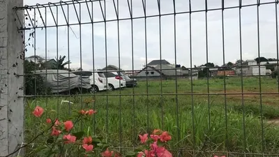 Situ Bunder, Depok, Jawa Barat, yang sekarang sebagian areanya menjadi lahan parkir kompleks perumahan. Sebelumnya, sempat menjadi tempat pembuangan sampah. [Suara.com/Erick Tanjung]