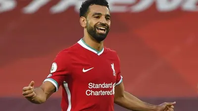 Striker Liverpool, Mohamed Salah, merayakan golnya usai menjebol gawang Leeds United di laga pekan pertama Liga Primer Inggris di Stadion Anfield, Liverpool, Sabtu (12/9/2020). (Foto: Shaun Botterill, Pool via AP)