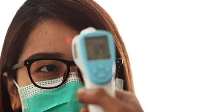 Ilustrasi termometer genggam atau biasa disebut dengan temperature gun atau thermal gun.