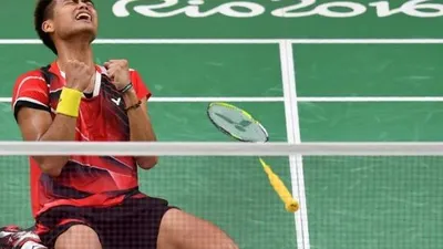 Tontowi Ahmad resmi pensiun dari bulu tangkis profeisonal. [AFP/Ben Stansall]
